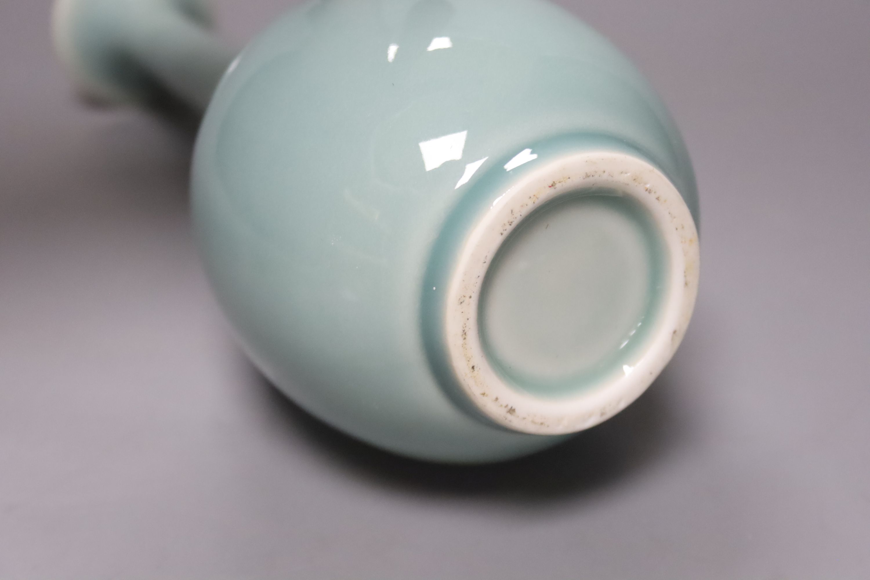 A Chinese celadon glazed vase, height 28cm, together with a crackle glaze bowl, a blue and white teabowl and saucer and a blue and white dish